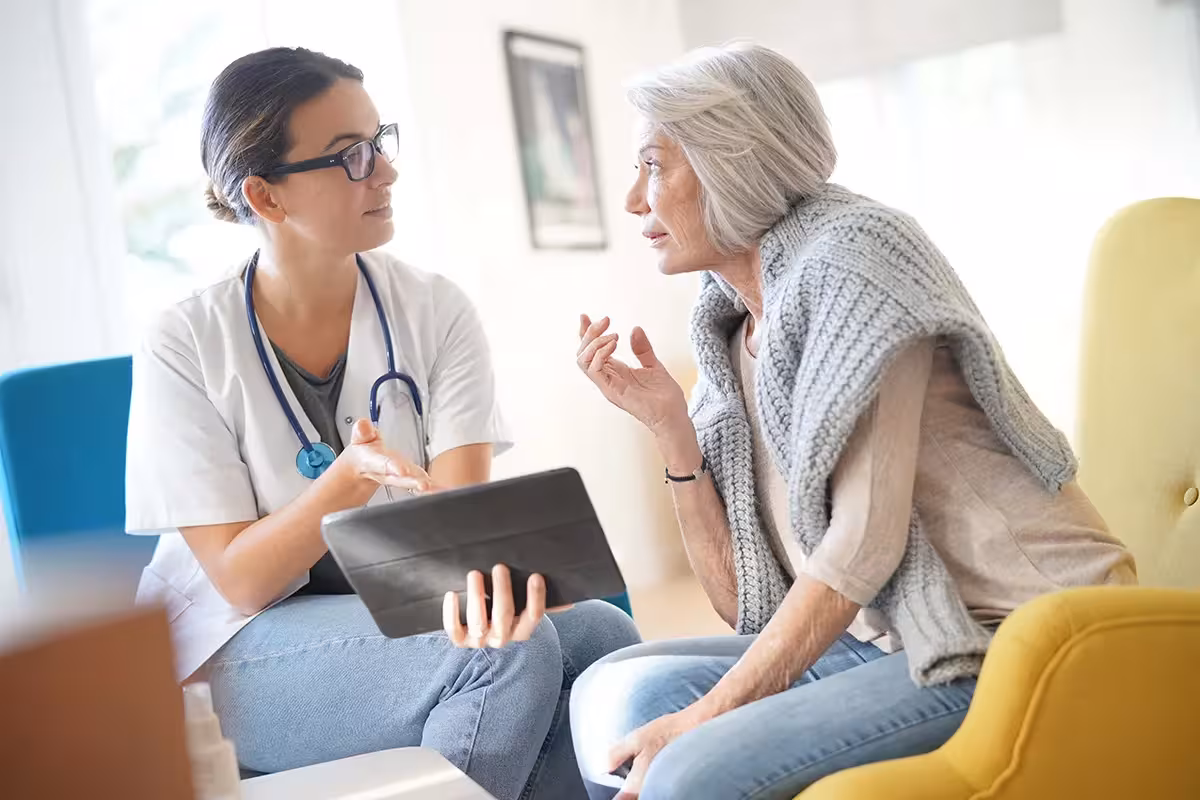 Private medical patient speaking to a doctor about treatment options